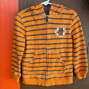 Vibrant Orange and Navy Striped Kids Hoodie Club Tiki logo